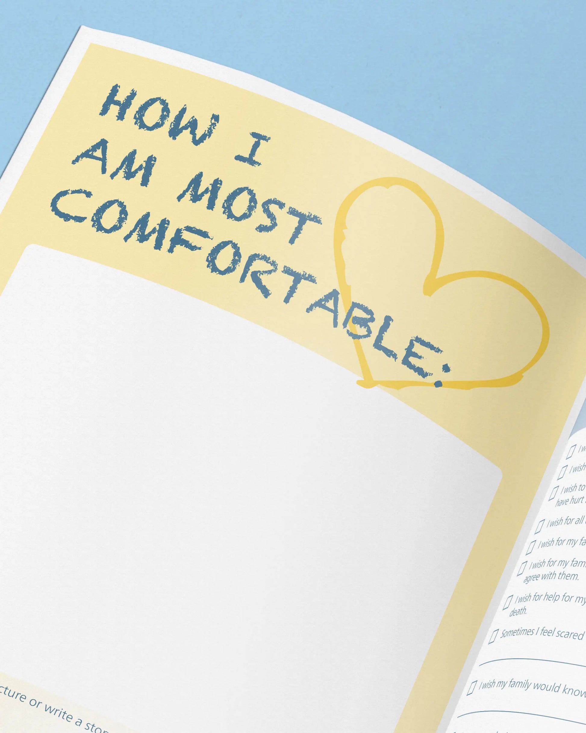 Sheet of paper with text 'How I am most comfortable:' and a heart drawn on a yellow border.