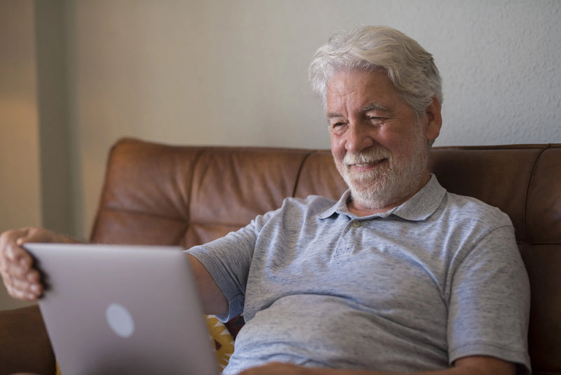 happy older man completing living will