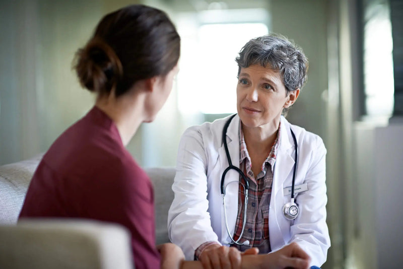 Doctor listening to a patient in a medical setting