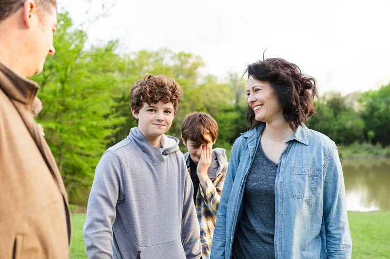 mid adult female admires her handsome teenage son