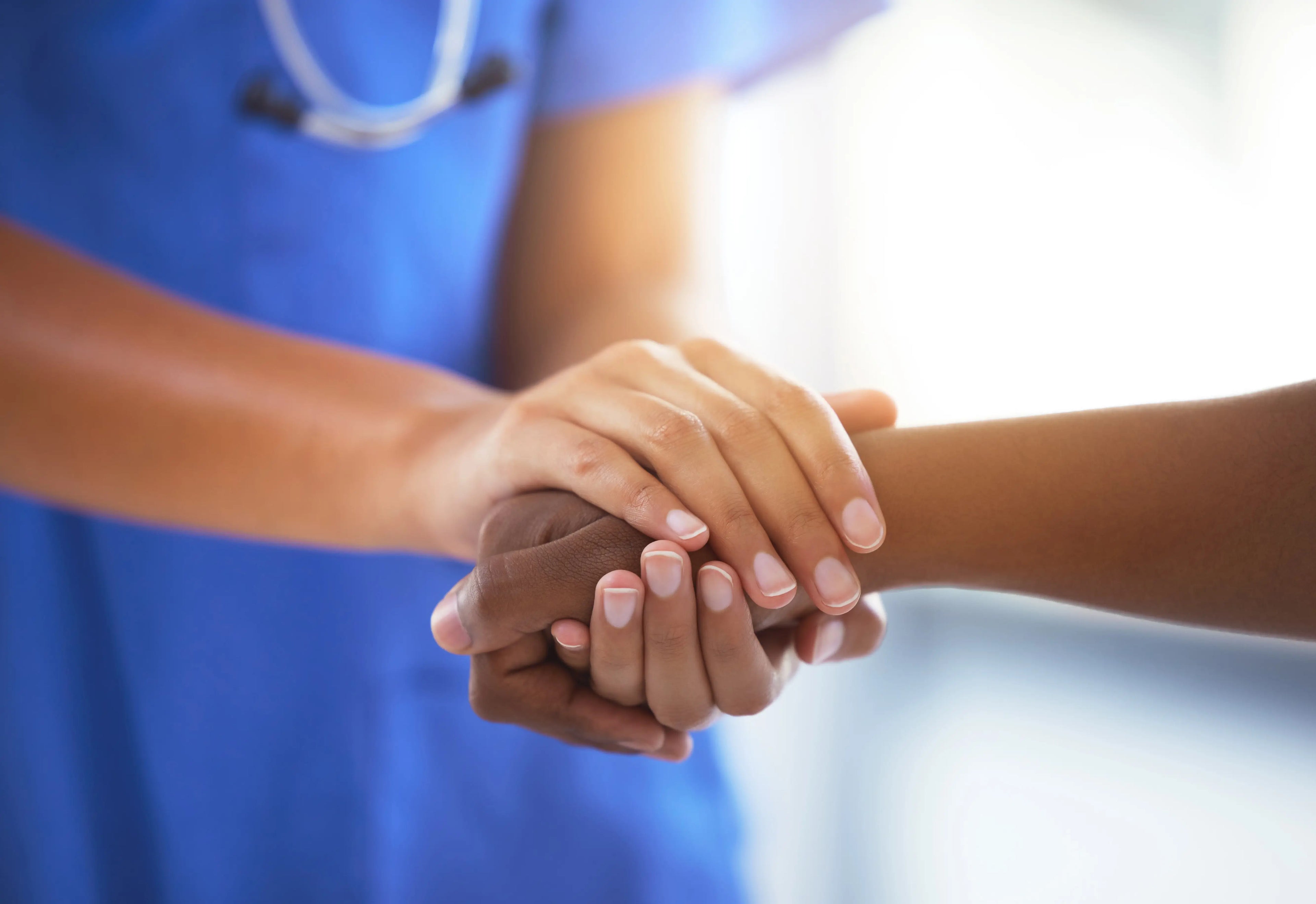 shot of an unrecognizable doctor holding hands with patient